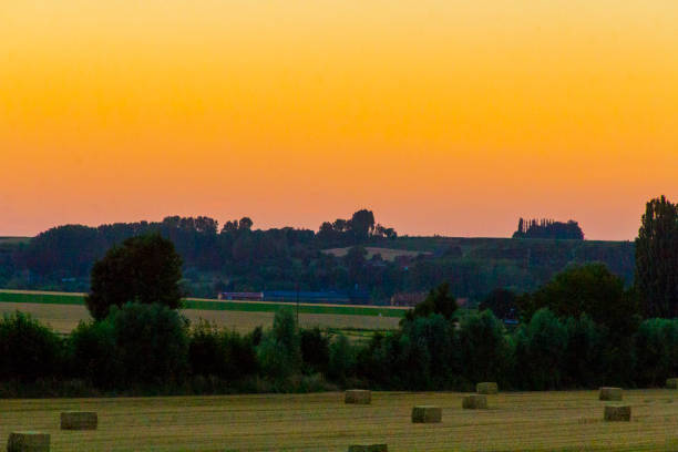 istock sundown dusk sunset vibrant sky rolling hills countryside rural scenic view 992765778