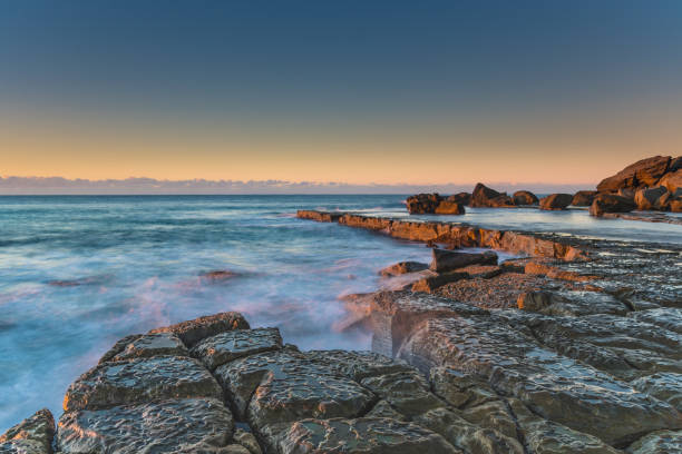 istock Sunrise, Sea and Rocks 992769670