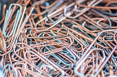 Many paper clips on a pile