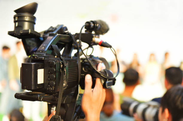 istock Photographer video recording activity 992779878