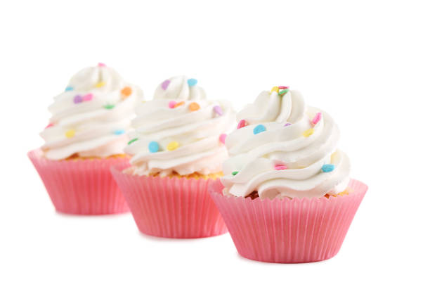 istock Tasty cupcakes isolated on a white 992788124