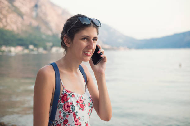 istock Young woman with hearing aid on the beach 992791554