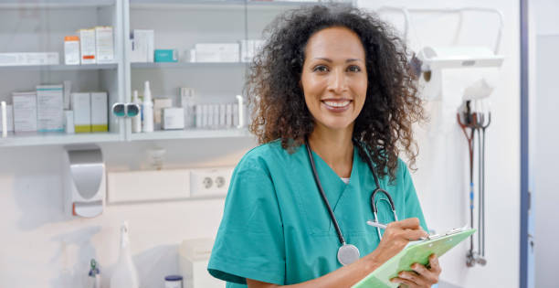 istock Portrait of smiling female veterinarian making notes 992791576