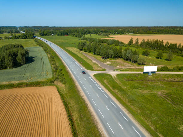 istock Road from above and white billboard. Aerial view. Drone. 992795016