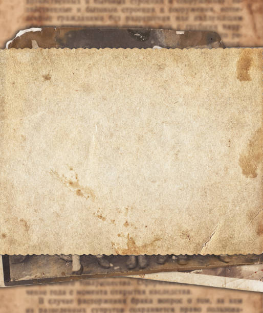 istock Vintage photo paper on old newspaper texture background 992802574