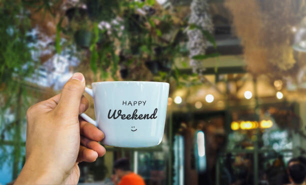 Happy weekend text on mug with cafe view Happy weekend text on mug with cafe view sunday stock pictures, royalty-free photos & images