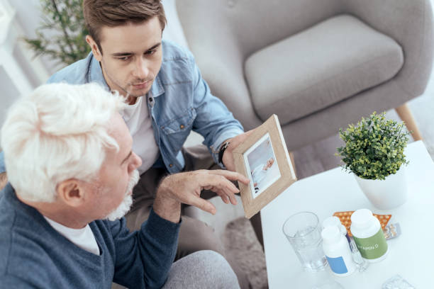 istock Handsome senior man recollecting past 992803384