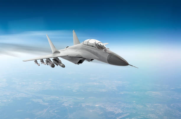 istock Fighter jet fly hight speed combat mission above the clouds. 992823416