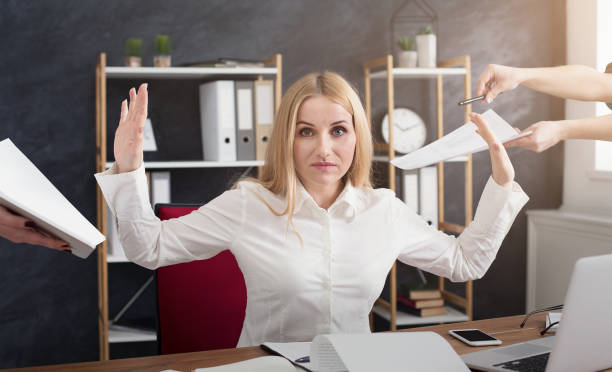 istock Serious businesswoman refusing to sign documents 992833382