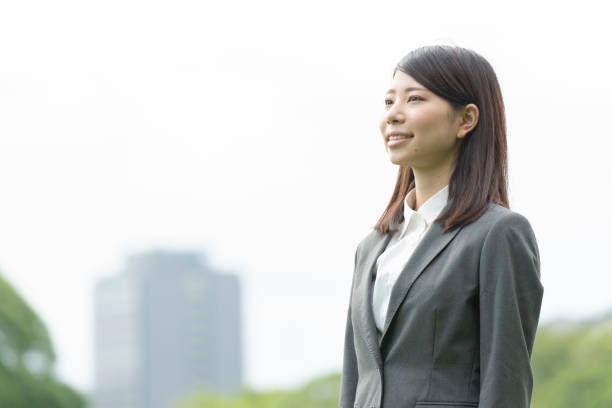 istock A woman in suit with green back 992833888