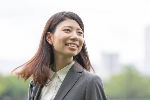 istock A woman in suit with green back 992834104