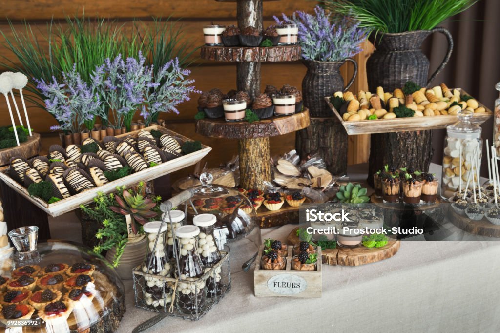 Candy bar for birthday party or wedding Candy bar for birthday party or wedding against wooden background Wedding Stock Photo