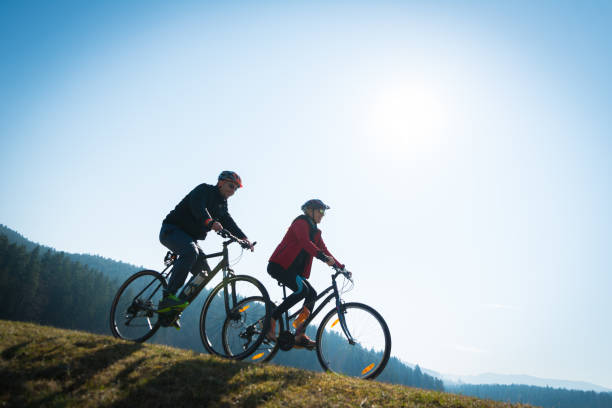 istock Couple Cycling Through Countryside Together 992837836