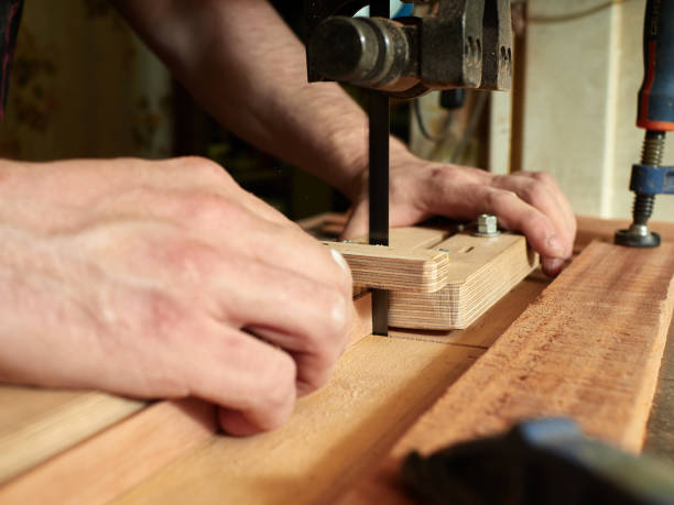 istock Lautner makes a classic guitar. Making slots in the lining. 992841244
