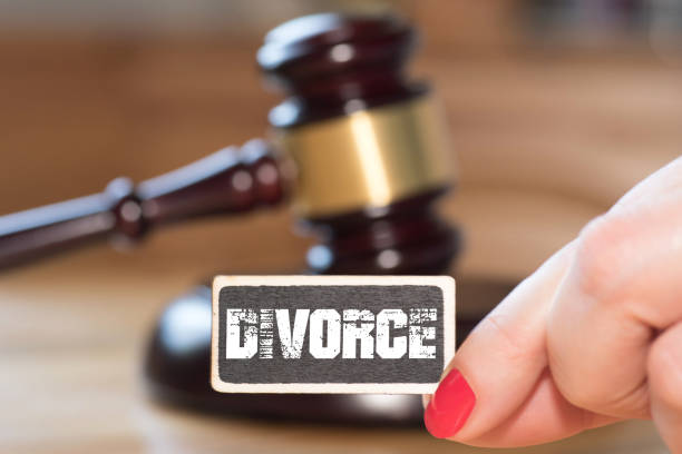istock A judge's hammer, a woman and divorce 992841340