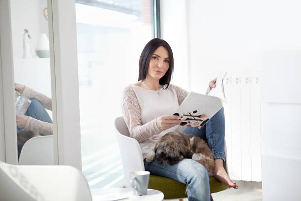 istock Woman reading magazine 992851020
