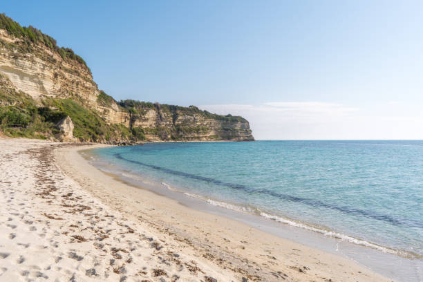 istock Beautiful empty sandy beach and turquoise sea 992855034
