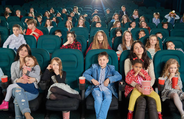 children and teens watching film in cinema. - audience surprise movie theater shock imagens e fotografias de stock