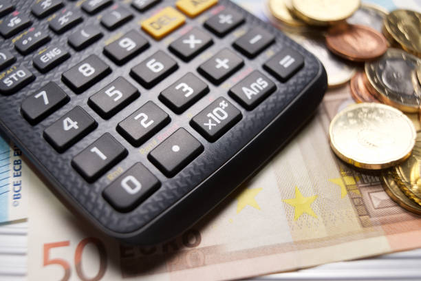 istock Calculator and cash 992859224