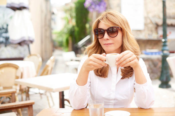 istock Relaxed woman enjoy her coffee 992860516