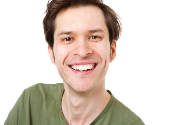 istock Close up casual man standing and smiling on white background 992863420