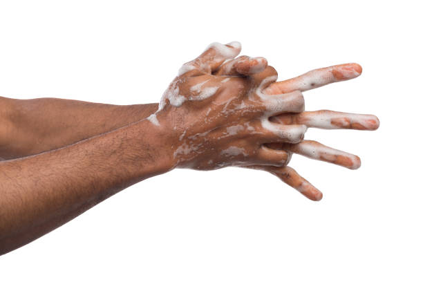 istock Black man washing hands isolated on white background 992863460