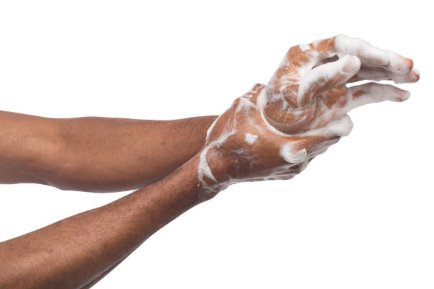 istock Black man washing hands isolated on white background 992863480