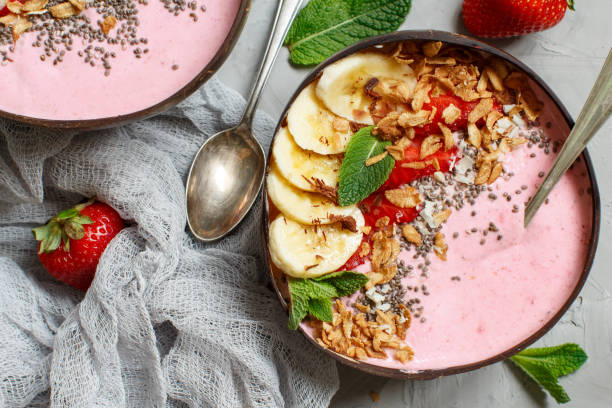 istock Strawberry and banana smoothie bowls 992867304