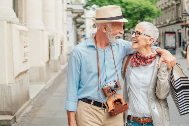 istock Husband and wife hugging while returning from shopping 992867458