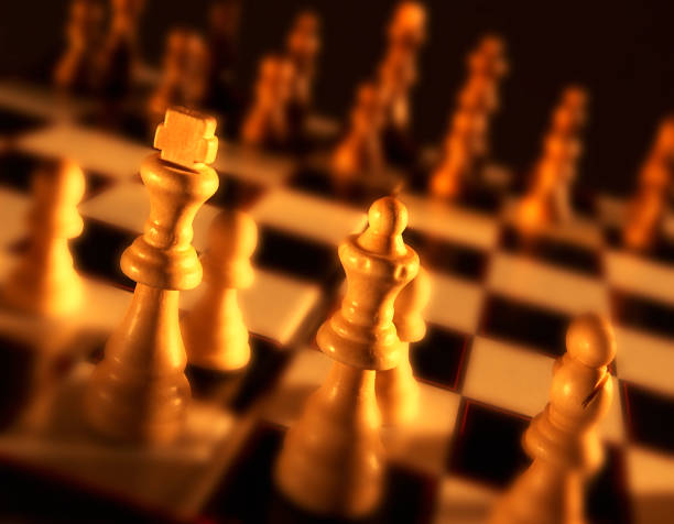 istock CLOSE UP OF KING AND QUEEN ON CHESS BOARD 992871306