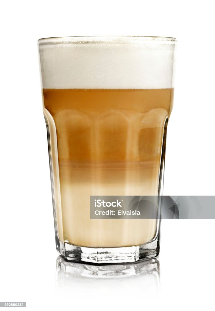 Hot milk coffee or latte macchiato glass, isolated Hot milk coffee or latte macchiato glass, isolated on white. Italian coffee with milk and layers. Gourmet coffee. Latte Stock Photo