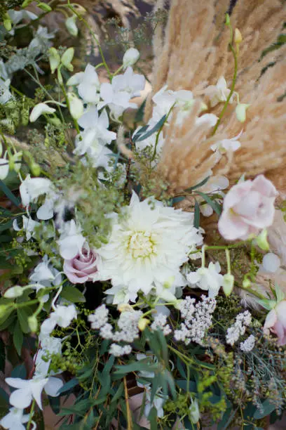 flower composition with roses, dryflowers in bohemian style