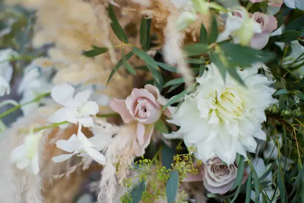 flower composition with roses, dryflowers in bohemian style