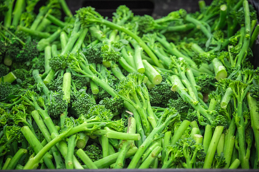 Fresh broccolini on display at Broadway market, a street market in Hackney, East London