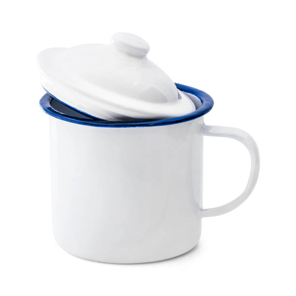 istock Enamel mug isolated on white background. Vintage cup made from tin material. ( Clipping path ) 992893970