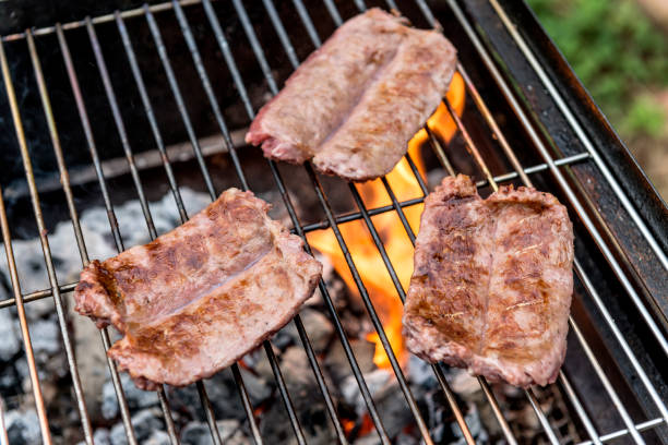 istock Sausages cook on the grill 992910834