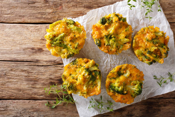 istock Broccoli Muffins with cheddar cheese and thyme close-up on the table. Horizontal top view 992910848