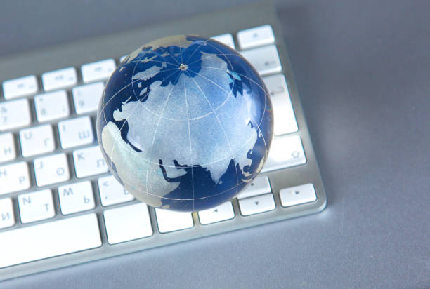 istock Cristal globe of the Earth on a Computer 992913280