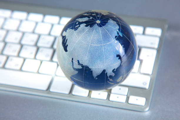 istock Cristal globe of the Earth on a Computer 992913310