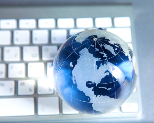 istock Cristal globe of the Earth on a Computer 992913342