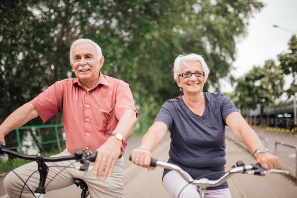 istock Happy senior people on bicycles 992913408