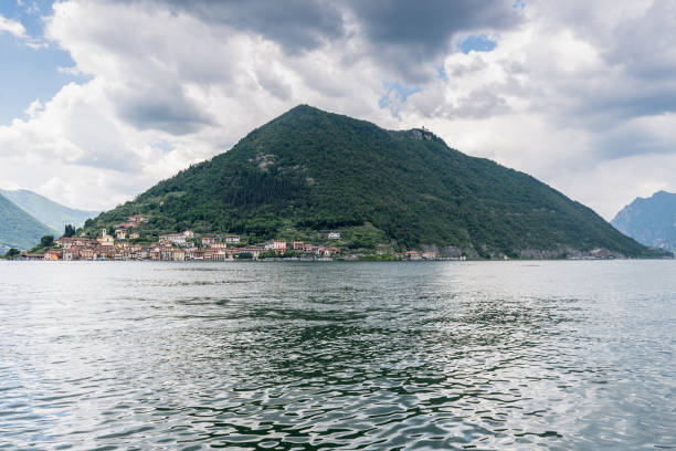Panoramic views across Lake Iseo from Sulzano to Mont Isola. This mountain island sits in the middle of the lake and is served by a ferry.