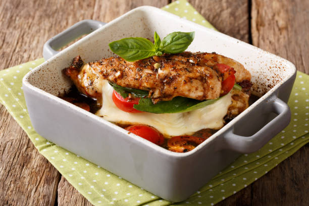 balsamic chicken stuffed with caprese close-up in a baking dish. horizontal - caprese salad salad restaurant vinegar imagens e fotografias de stock