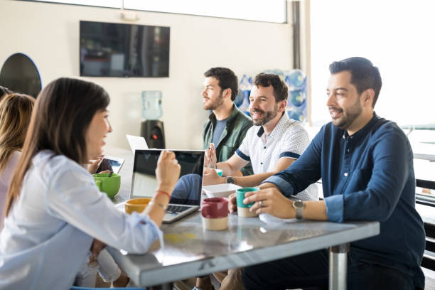 istock Business people chatting over coffee 992923916