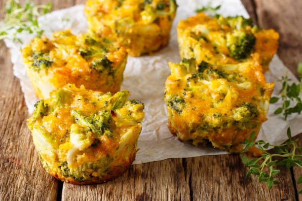 Delicious and healthy broccoli bites with cheddar cheese, egg and thyme close-up. horizontal stock photo
