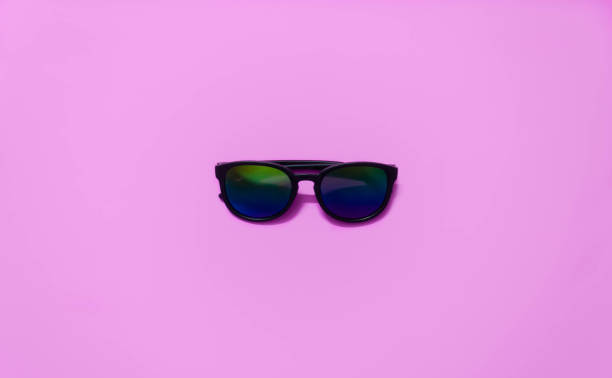 istock sunglasses in pink background. 992927918