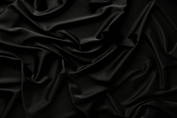 istock Background of black satin fabric 992942342
