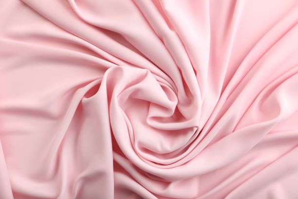 istock Background of pink satin fabric 992946352