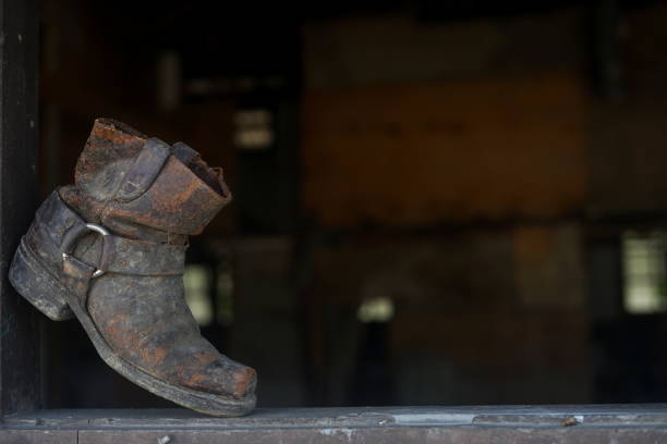 istock Old dusty vintage boot at abandoned building 992946372