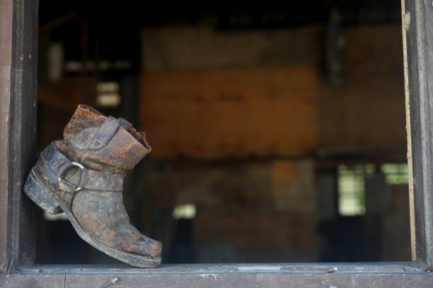 istock Old dusty vintage boot at abandoned building 992947228